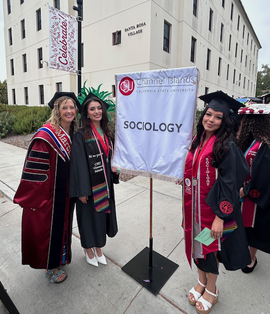 chair with students soc banner