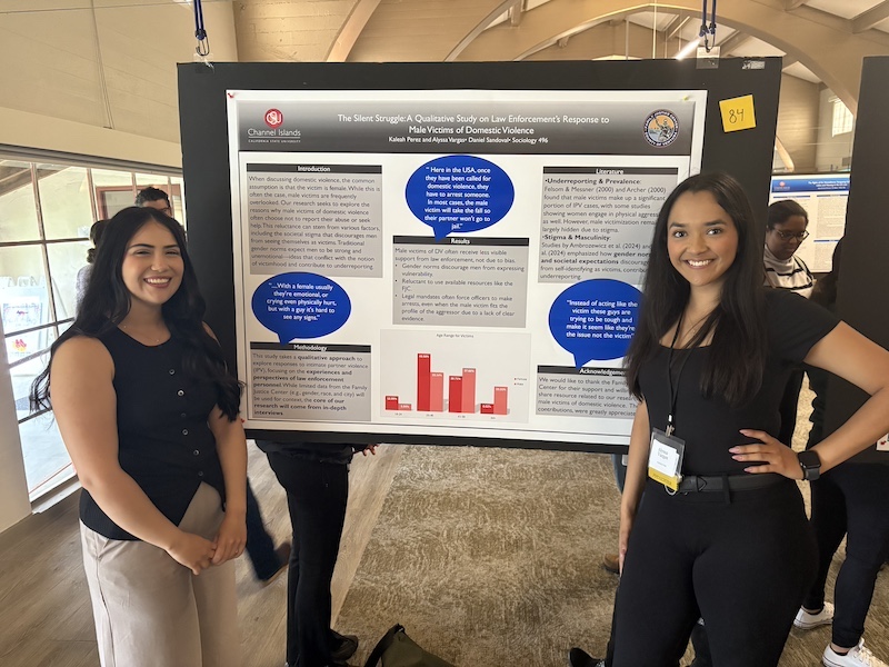 Capstone Students Presentating a Poster at CI Student Research Conference